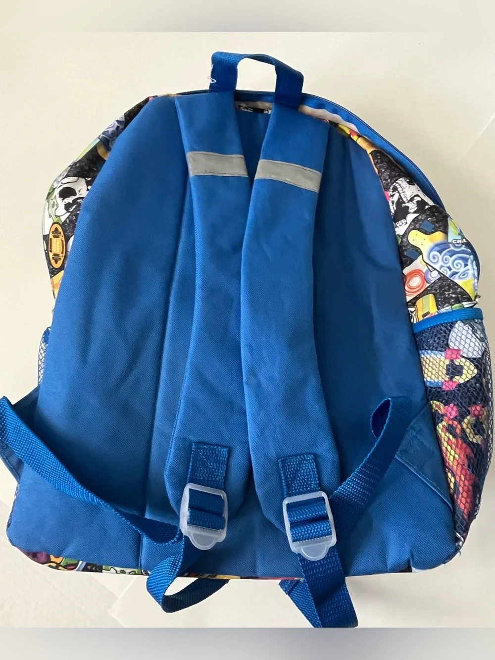 This Reboot Kids Blue Multi-Print Backpack - Fun Skateboard Pattern